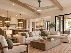 Avenor 62-inch ceiling fan in Bronze and White Oak installed in a warm modern living room with exposed wood beams.