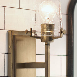 Buster 5" One Light Wall Sconce, Clear Seeded Glass / Champagne Bronze