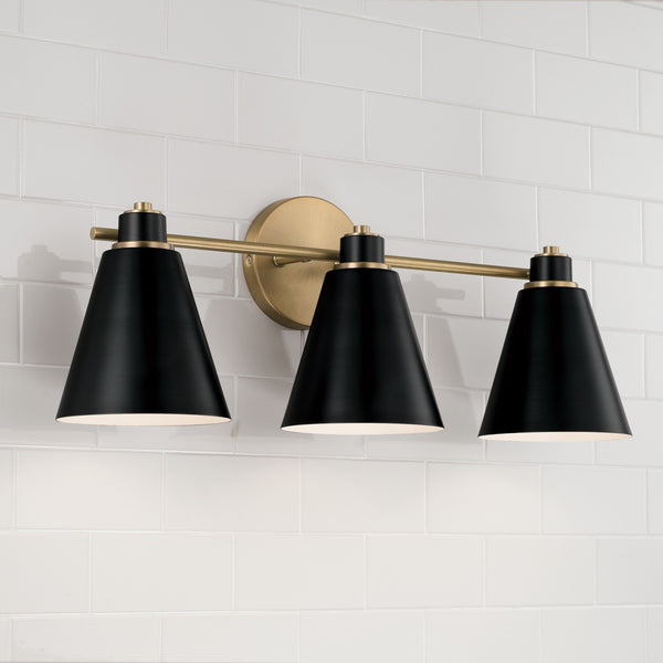 Collyn 24" Three Light Vanity, Aged Brass and Black