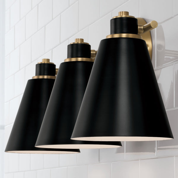 Collyn 24" Three Light Vanity, Aged Brass and Black